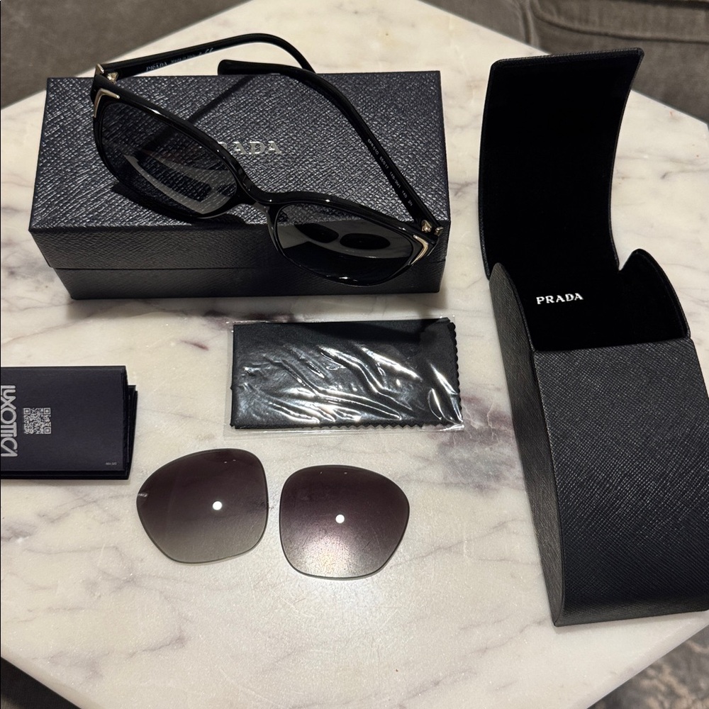 Prada Elegant Black Sunglasses with Case, lenses are new.